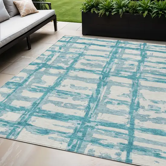 Teal Blue Aqua And Ivory Striped Washable Indoor Outdoor Area Rug Photo 1