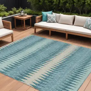 Photo of Teal Blue Aqua And Ivory Striped Washable Indoor Outdoor Area Rug