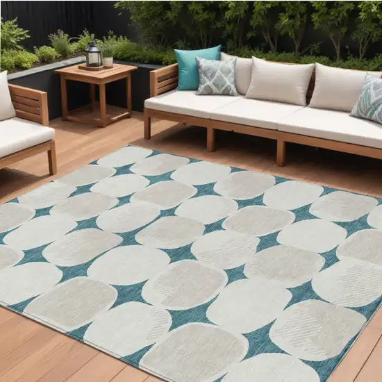 Teal Blue Beige And Ivory Abstract Washable Indoor Outdoor Area Rug Photo 1