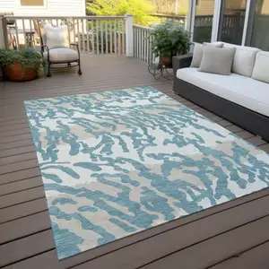 Photo of Teal Blue Beige And Ivory Animal Print Washable Indoor Outdoor Area Rug