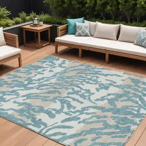 Photo of Teal Blue Beige And Ivory Animal Print Washable Indoor Outdoor Area Rug