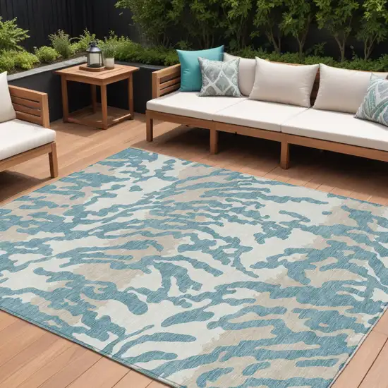 Teal Blue Beige And Ivory Animal Print Washable Indoor Outdoor Area Rug Photo 1