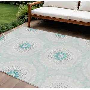 Photo of Teal Blue Beige And Ivory Floral Medallion Washable Indoor Outdoor Area Rug