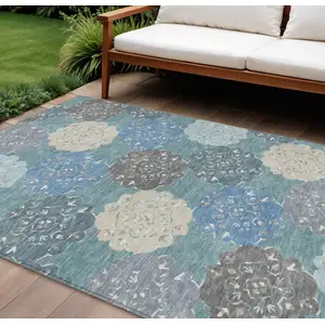 Photo of Teal Blue Beige And Ivory Quatrefoil Washable Indoor Outdoor Area Rug
