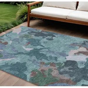 Photo of Teal Blue Beige And Pale Aqua Abstract Washable Indoor Outdoor Area Rug