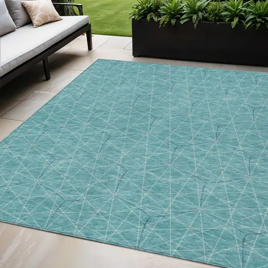 Teal Blue Black And Ivory Geometric Washable Indoor Outdoor Area Rug Photo 1