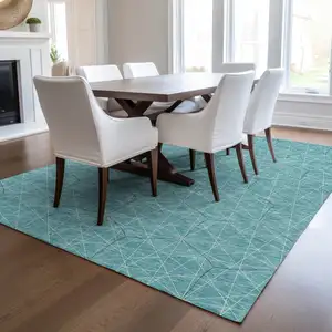 Photo of Teal Blue Black And Ivory Geometric Washable Indoor Outdoor Area Rug