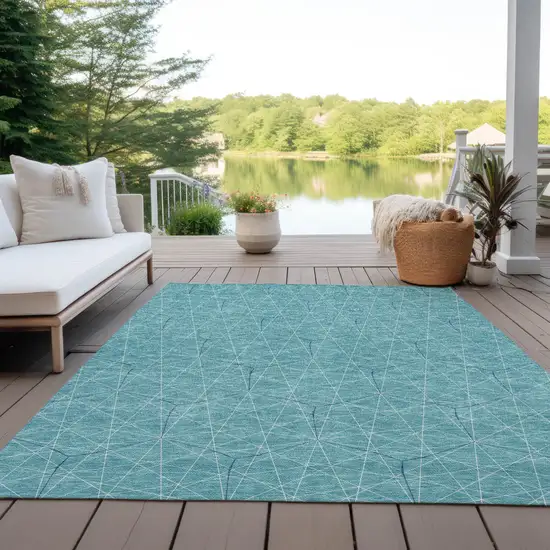 Teal Blue Black And Ivory Geometric Washable Indoor Outdoor Area Rug Photo 9