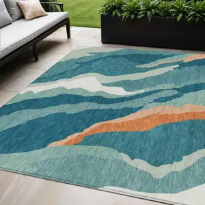 Photo of Teal Blue Copper And Ivory Abstract Washable Indoor Outdoor Area Rug