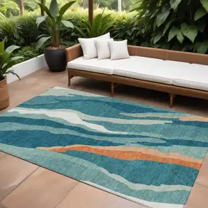 Photo of Teal Blue Copper And Ivory Abstract Washable Indoor Outdoor Area Rug
