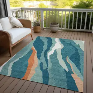 Photo of Teal Blue Copper And Ivory Abstract Washable Indoor Outdoor Area Rug