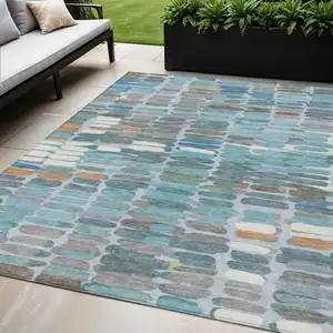 Photo of Teal Blue Copper And Ivory Abstract Washable Indoor Outdoor Area Rug