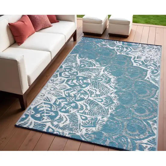 Teal Blue Floral Machine Braided Distressed Area Rug With UV Protection Photo 1