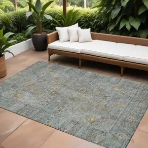 Photo of Teal Blue Gold And Beige Oriental Washable Indoor Outdoor Area Rug