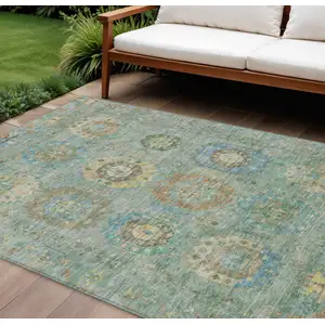 Photo of Teal Blue Gold And Copper Medallion Washable Indoor Outdoor Area Rug