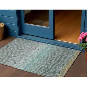 Photo of Teal Blue Gold And Gray Abstract Washable Indoor Outdoor Area Rug