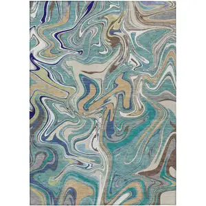 Photo of Teal Blue Gold And Ivory Abstract Washable Indoor Outdoor Area Rug