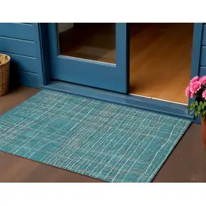 Photo of Teal Blue Gray And Brown Striped Washable Indoor Outdoor Area Rug