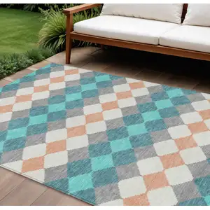 Photo of Teal Blue Gray And Copper Geometric Washable Indoor Outdoor Area Rug