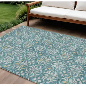 Photo of Teal Blue Gray And Gold Floral Washable Indoor Outdoor Area Rug