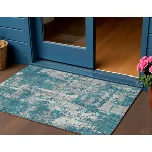 Photo of Teal Blue Gray And Ivory Abstract Washable Indoor Outdoor Area Rug