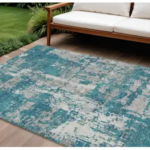 Photo of Teal Blue Gray And Ivory Abstract Washable Indoor Outdoor Area Rug