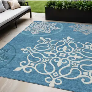 Photo of Teal Blue Gray And Ivory Floral Medallion Washable Indoor Outdoor Area Rug