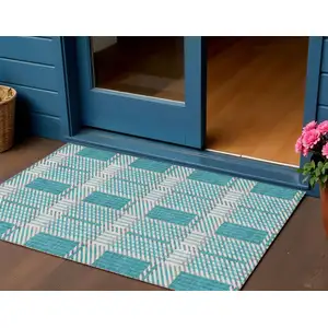 Photo of Teal Blue Gray And Ivory Plaid Washable Indoor Outdoor Area Rug