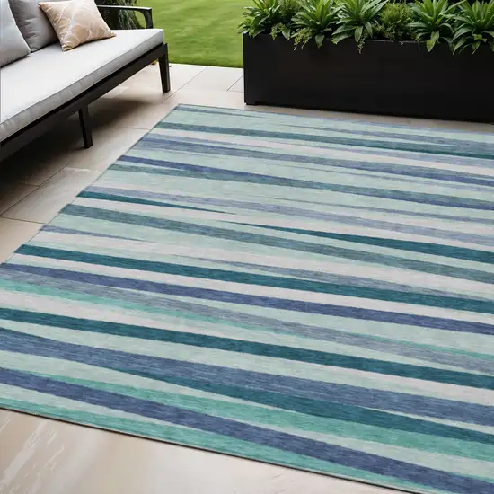 Teal Blue Gray And Ivory Striped Washable Indoor Outdoor Area Rug Photo 1