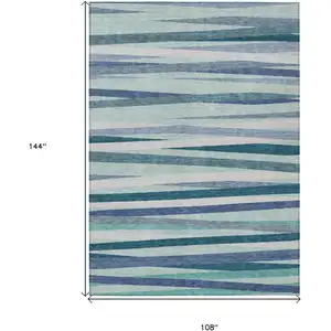 Photo of Teal Blue Gray And Ivory Striped Washable Indoor Outdoor Area Rug