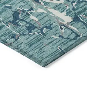 Photo of Teal Blue Gray And Ivory Striped Washable Indoor Outdoor Area Rug