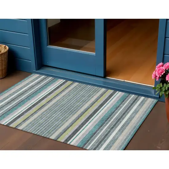 Teal Blue Gray And Ivory Striped Washable Indoor Outdoor Area Rug Photo 1