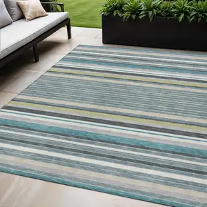 Photo of Teal Blue Gray And Ivory Striped Washable Indoor Outdoor Area Rug