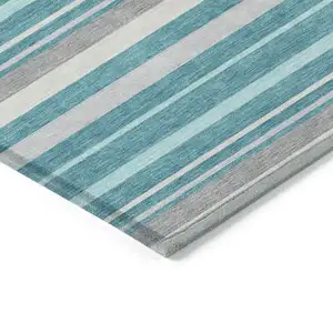 Photo of Teal Blue Gray And Ivory Striped Washable Indoor Outdoor Area Rug
