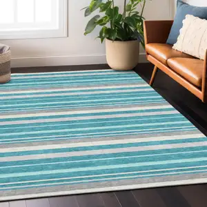 Photo of Teal Blue Gray And Ivory Striped Washable Indoor Outdoor Area Rug