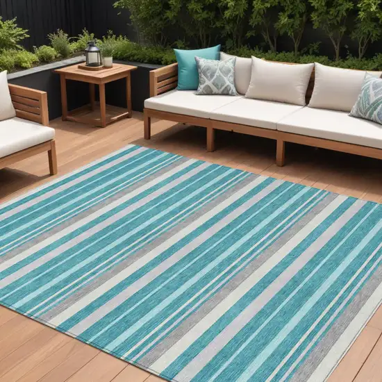 Teal Blue Gray And Ivory Striped Washable Indoor Outdoor Area Rug Photo 1