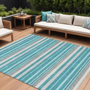 Photo of Teal Blue Gray And Ivory Striped Washable Indoor Outdoor Area Rug