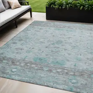 Photo of Teal Blue Gray And Silver Tribal Washable Indoor Outdoor Area Rug