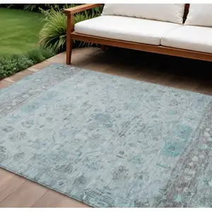 Photo of Teal Blue Gray And Silver Tribal Washable Indoor Outdoor Area Rug
