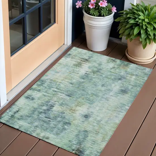 Teal Blue Green And Ivory Abstract Washable Indoor Outdoor Area Rug Photo 1