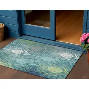 Photo of Teal Blue Green And Ivory Floral Washable Indoor Outdoor Area Rug
