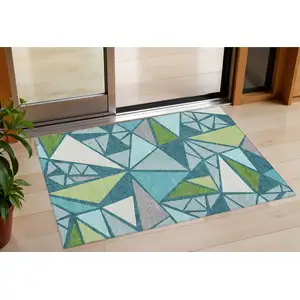 Photo of Teal Blue Green And Ivory Geometric Washable Indoor Outdoor Area Rug