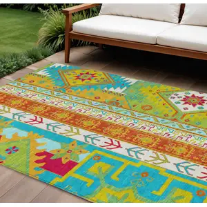 Photo of Teal Blue Green And Pink Aztec Washable Indoor Outdoor Area Rug