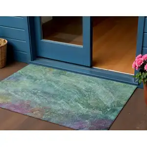 Photo of Teal Blue Green And Purple Abstract Washable Indoor Outdoor Area Rug