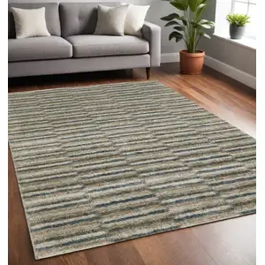Photo of Teal Blue Grey And Tan Geometric Power Loom Stain Resistant Area Rug