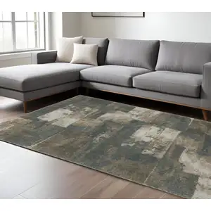 Photo of Teal Blue Grey Tan And Beige Geometric Power Loom Stain Resistant Area Rug