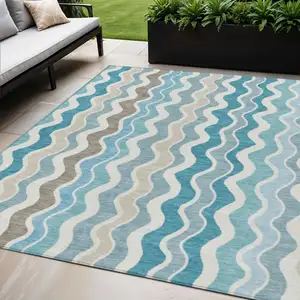 Photo of Teal Blue Ivory And Beige Striped Washable Indoor Outdoor Area Rug