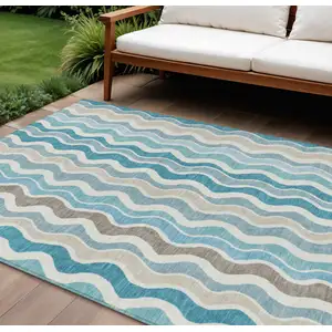 Photo of Teal Blue Ivory And Beige Striped Washable Indoor Outdoor Area Rug