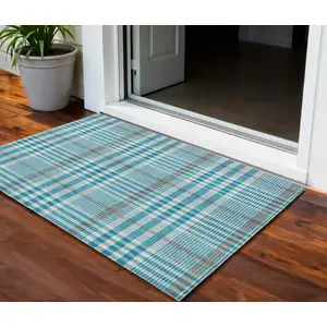 Photo of Teal Blue Ivory And Brown Plaid Washable Indoor Outdoor Area Rug