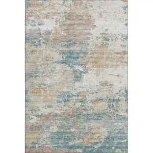 Photo of Teal Blue Ivory And Copper Abstract Washable Area Rug With UV Protection